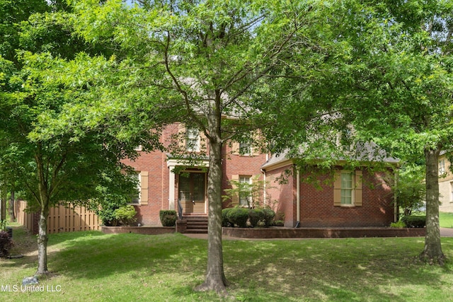4788 Bon Jour Ln, Nesbit, MS 38651 - view of property hidden behind natural elements featuring brick siding and a front yard