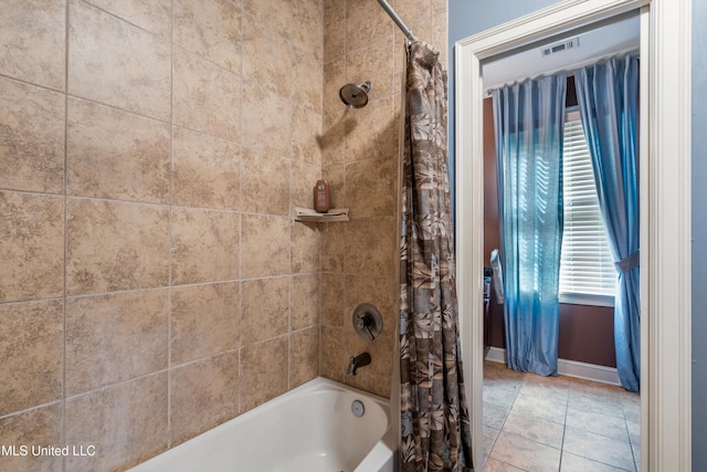 4788 Bon Jour Ln, Nesbit, MS 38651 - bathroom featuring plenty of natural light, shower / bath combo with shower curtain, and baseboards