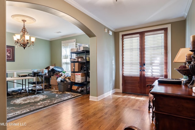 4788 Bon Jour Ln, Nesbit, MS 38651 - office space with arched walkways, wood finished floors, ornamental molding, french doors, and a chandelier