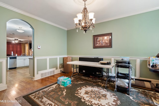 4788 Bon Jour Ln, Nesbit, MS 38651 - office with crown molding, arched walkways, wood finished floors, wainscoting, and a chandelier