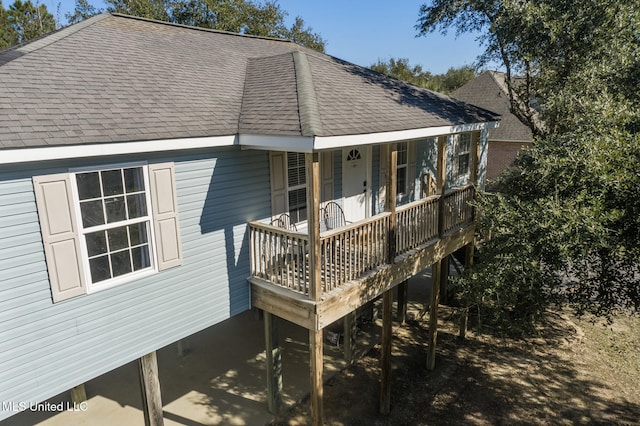 view of front of home featuring a porch and roof with shingles