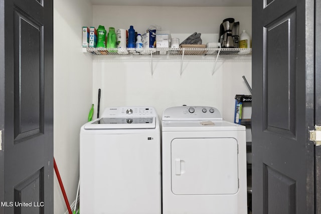 laundry area with laundry area and separate washer and dryer