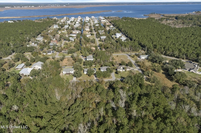 aerial view featuring a water view and a view of trees