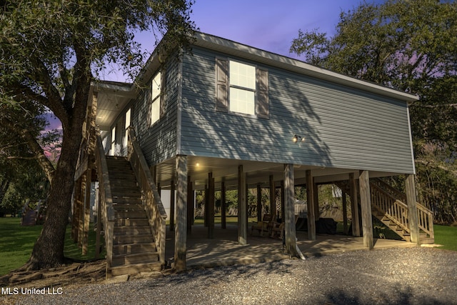 exterior space with stairway and a patio