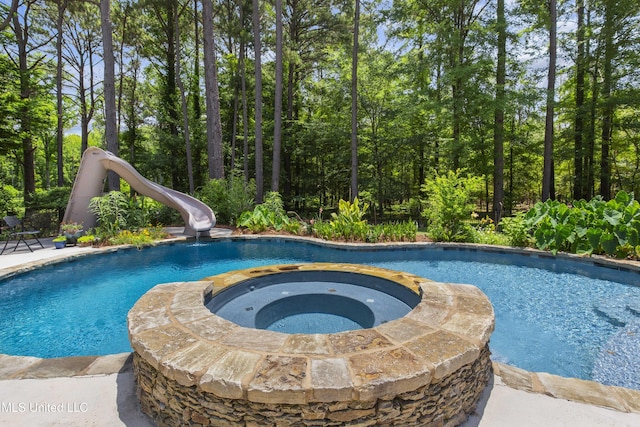 268 Sundial Rd, Madison, MS 39110 - view of pool featuring a water slide and a pool with connected hot tub
