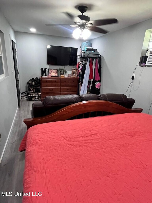 bedroom with hardwood / wood-style flooring and ceiling fan