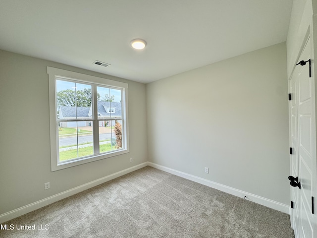 unfurnished room featuring carpet flooring