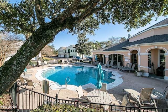 view of swimming pool with a patio and a jacuzzi