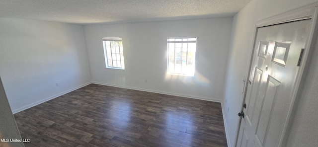 245 Mcdonnell Ave Unit D-226, Biloxi, MS 39531 - empty room featuring dark wood-type flooring, a textured ceiling, and baseboards