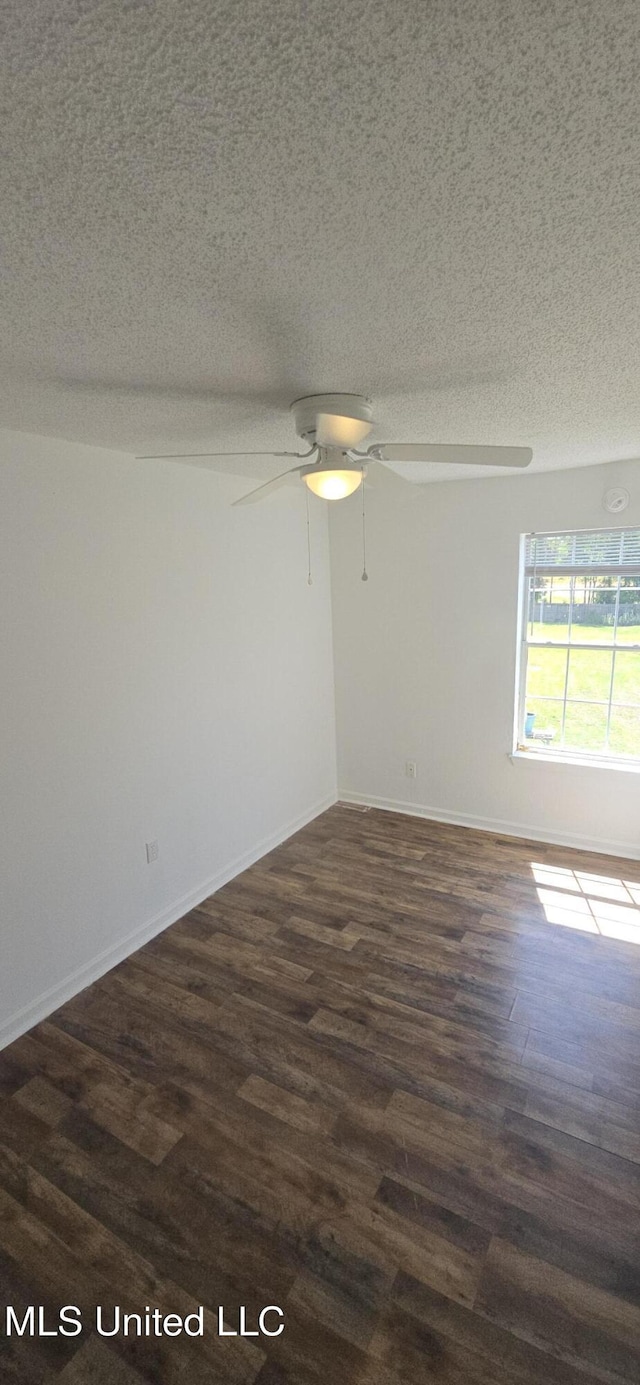 245 Mcdonnell Ave Unit D-226, Biloxi, MS 39531 - spare room featuring a textured ceiling, a ceiling fan, dark wood finished floors, and baseboards