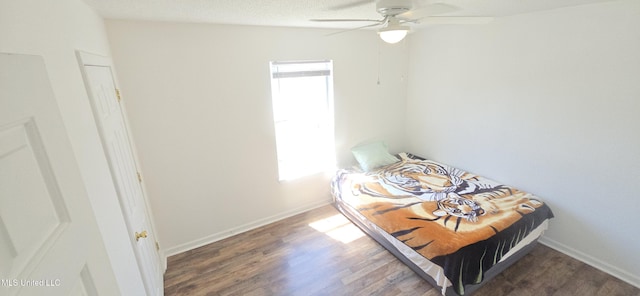 245 Mcdonnell Ave Unit D-226, Biloxi, MS 39531 - bedroom featuring wood finished floors, a ceiling fan, and baseboards