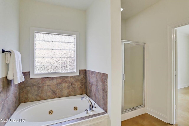 bathroom featuring independent shower and bath