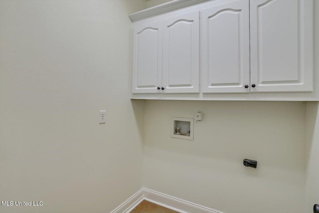 washroom featuring cabinets and washer hookup