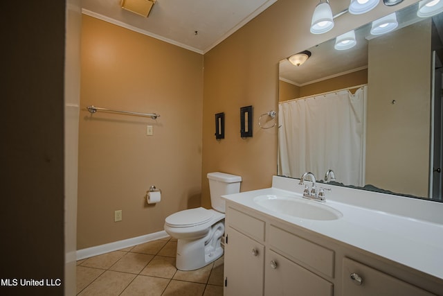 bathroom with baseboards, toilet, crown molding, vanity, and tile patterned floors
