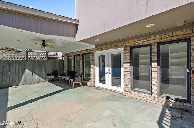 view of patio featuring ceiling fan and french doors