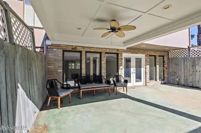 view of patio / terrace featuring ceiling fan and french doors