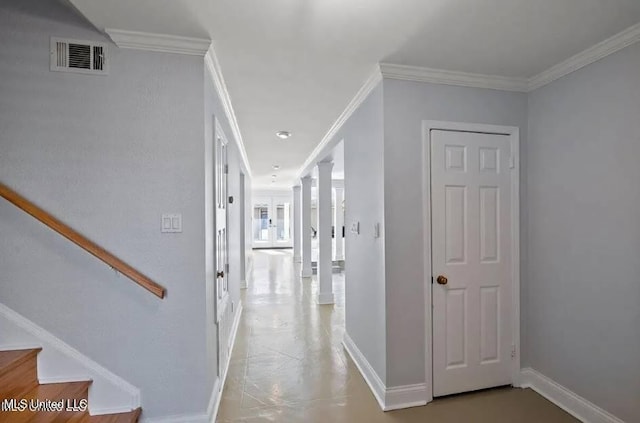 corridor featuring ornamental molding and ornate columns