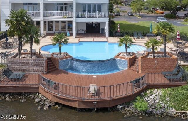 550 Post Rd Unit 116, Ridgeland, MS 39157 - swimming pool featuring a jacuzzi, a patio, and a water view