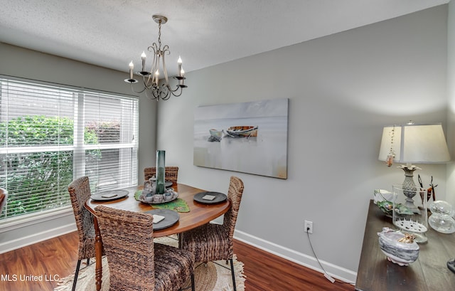 550 Post Rd Unit 116, Ridgeland, MS 39157 - dining space featuring a chandelier, wood finished floors, and a textured ceiling