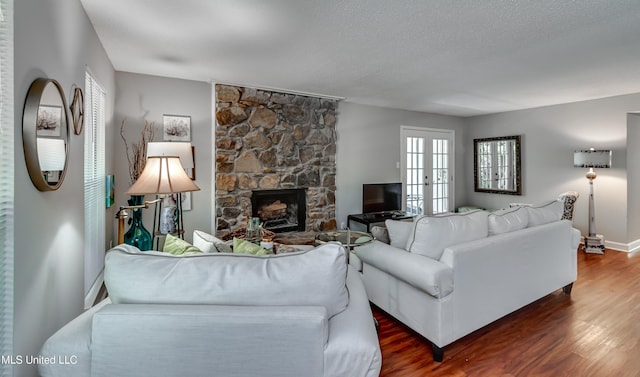 550 Post Rd Unit 116, Ridgeland, MS 39157 - living area featuring wood finished floors and a fireplace