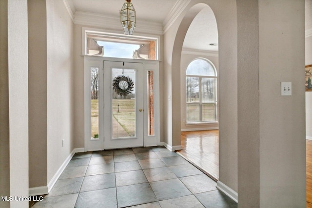 entryway with crown molding and light wood-type flooring