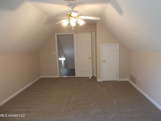 additional living space with ceiling fan, carpet flooring, and vaulted ceiling