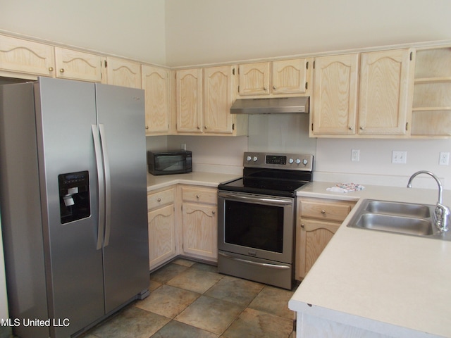 kitchen featuring light brown cabinets, stainless steel appliances, and sink