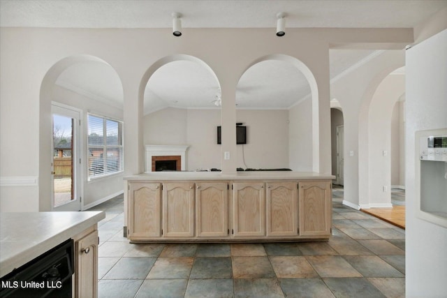 kitchen featuring crown molding, light brown cabinets, and beverage cooler