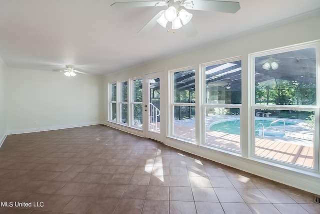 unfurnished room with tile patterned flooring and ceiling fan