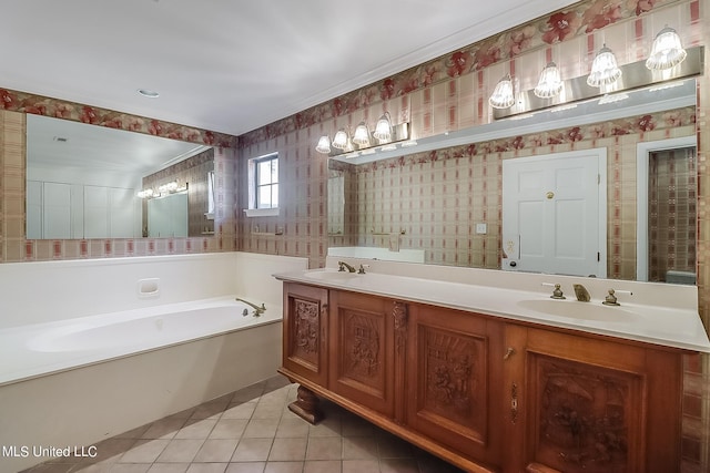 bathroom with tile patterned flooring, vanity, and a tub