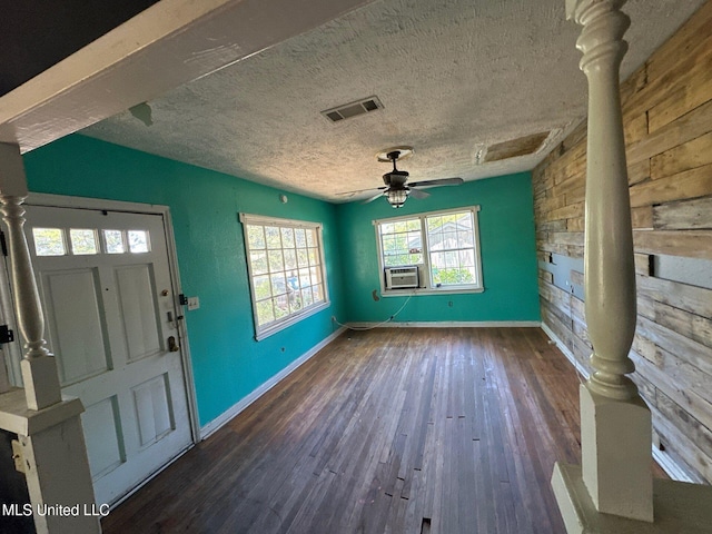 117 SE 5th Ave, Magee, MS 39111 - foyer entrance with baseboards, ceiling fan, cooling unit, dark wood-style flooring, and a textured ceiling