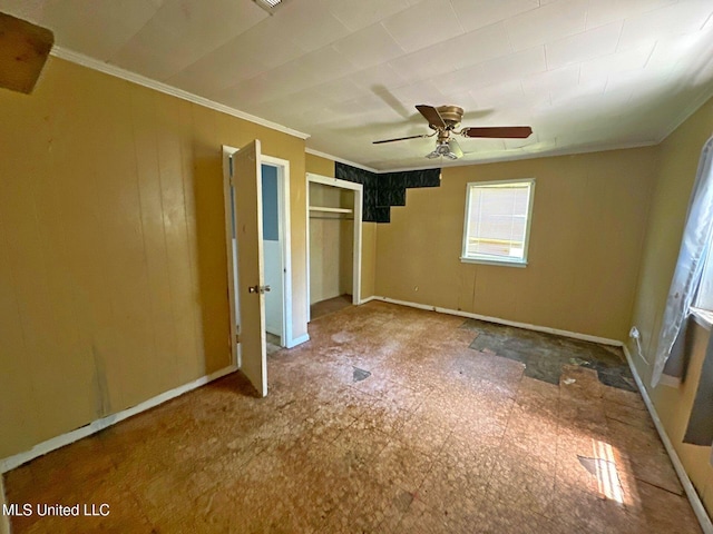 117 SE 5th Ave, Magee, MS 39111 - unfurnished bedroom with ornamental molding, a closet, baseboards, and a ceiling fan