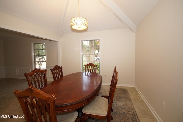 dining area with vaulted ceiling