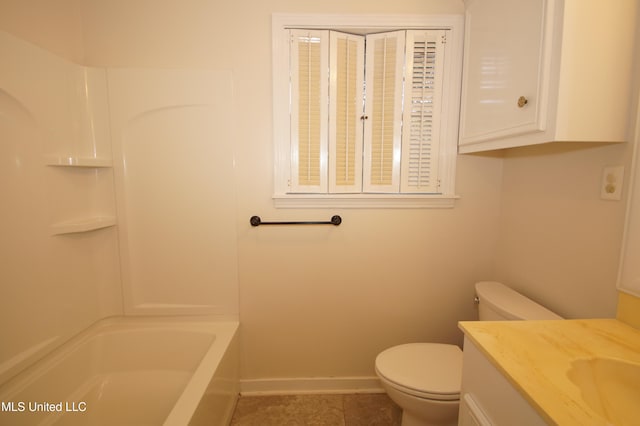 bathroom with vanity, tile patterned floors, and toilet