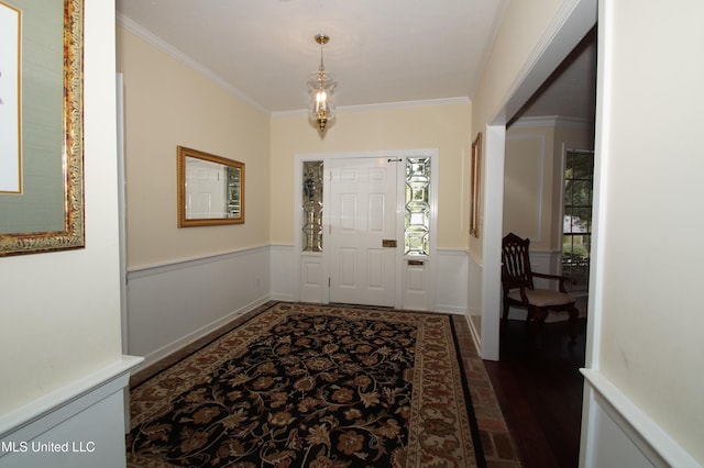 entryway with plenty of natural light, dark hardwood / wood-style floors, and crown molding