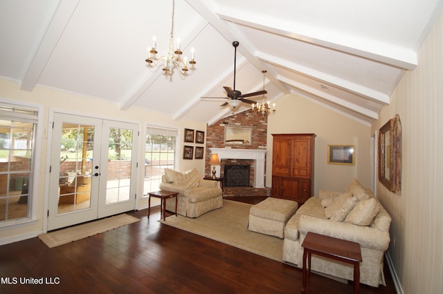 living room featuring lofted ceiling with beams, ceiling fan, dark hardwood / wood-style floors, a brick fireplace, and french doors