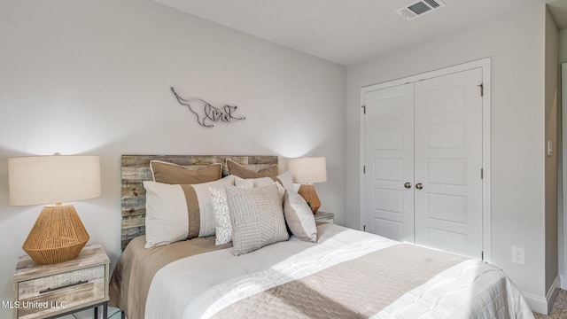 bedroom with a closet and baseboards