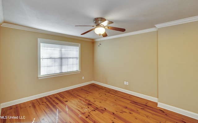 empty room featuring hardwood / wood-style flooring, ceiling fan, and ornamental molding