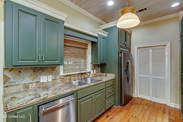 kitchen with pendant lighting, sink, light hardwood / wood-style flooring, ornamental molding, and appliances with stainless steel finishes