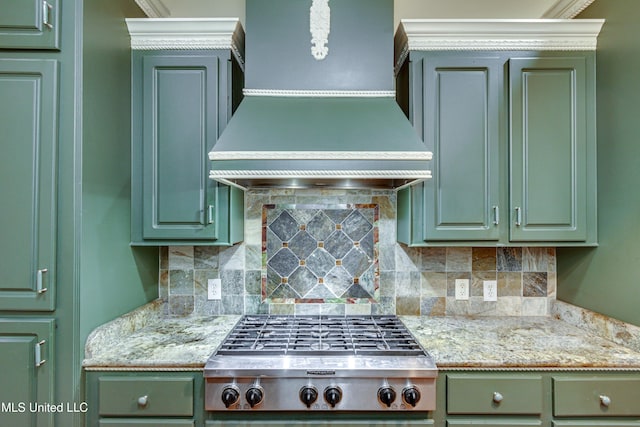 kitchen featuring backsplash, green cabinets, and custom exhaust hood