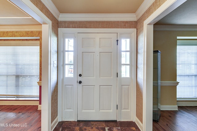 entrance foyer featuring dark hardwood / wood-style flooring and ornamental molding