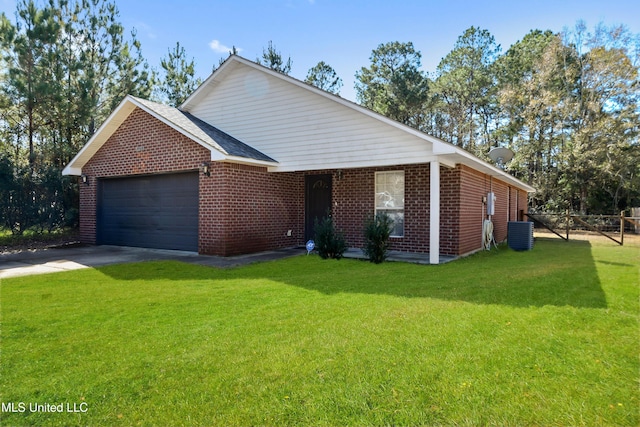 ranch-style home featuring a garage, a front yard, and central air condition unit