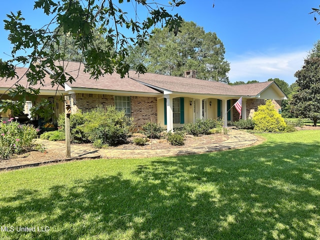 ranch-style house with a front lawn