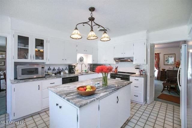 708 Ratliff Ferry Rd, Canton, MS 39046 - kitchen with pendant lighting, white cabinetry, a kitchen island, and black appliances