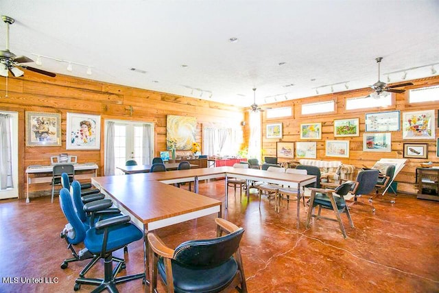 708 Ratliff Ferry Rd, Canton, MS 39046 - interior space with ceiling fan, french doors, wood walls, concrete floors, and track lighting