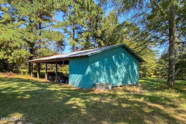708 Ratliff Ferry Rd, Canton, MS 39046 - view of property exterior with an outbuilding and a lawn