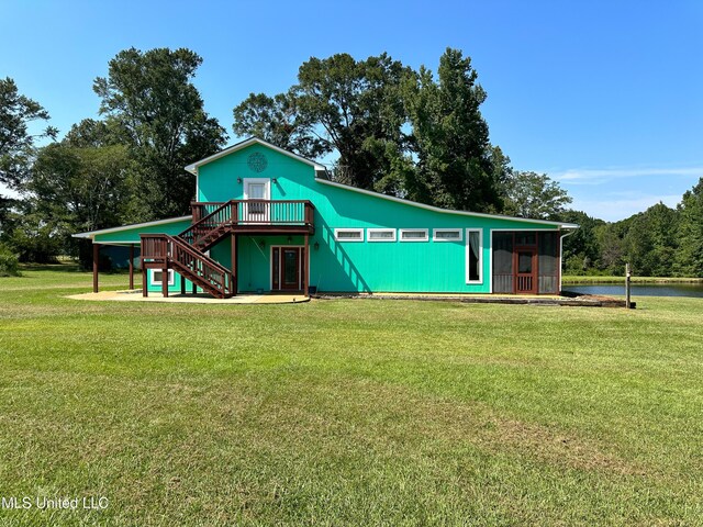 708 Ratliff Ferry Rd, Canton, MS 39046 - exterior space with a yard and a deck with water view