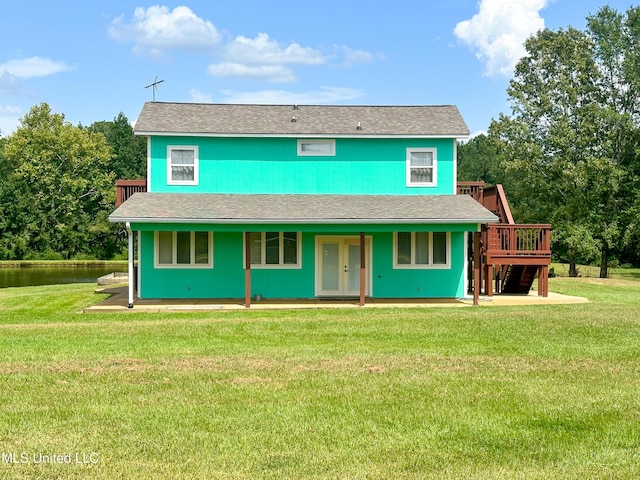 708 Ratliff Ferry Rd, Canton, MS 39046 - view of front facade with a water view, french doors, and a front lawn