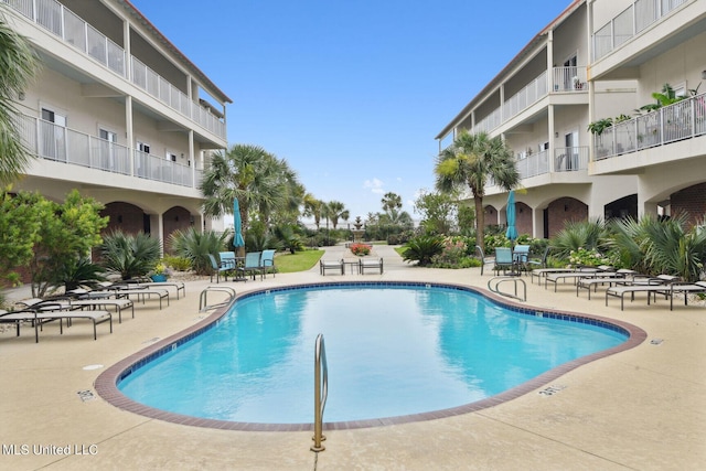 view of pool featuring a patio