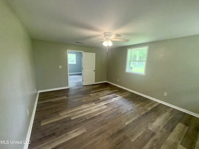106 Edd Monk St, Mendenhall, MS 39114 - spare room featuring ceiling fan, plenty of natural light, and dark wood-type flooring